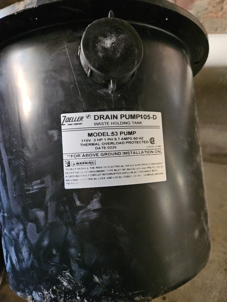 Zoeller pump installed in a Greensboro basement by Custom Electric and Plumbing
