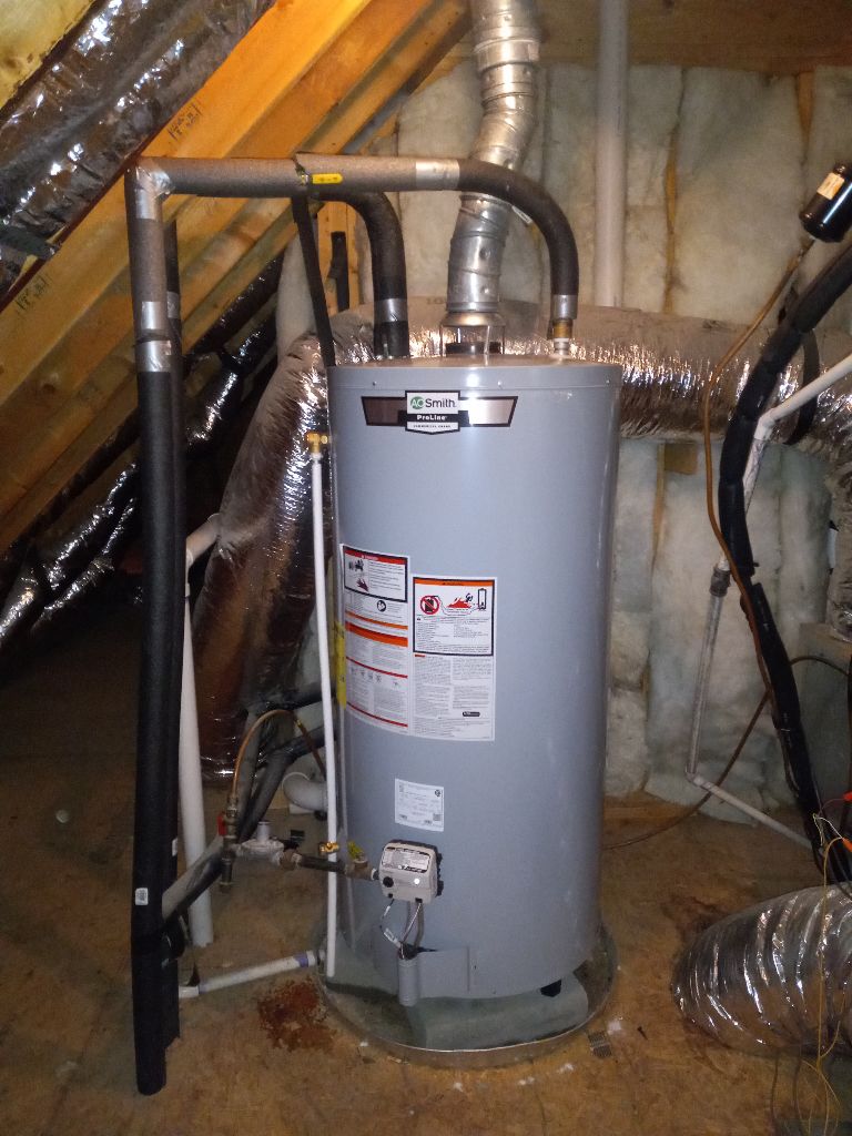 Tank water heater installed by Custom Electric and Plumbing